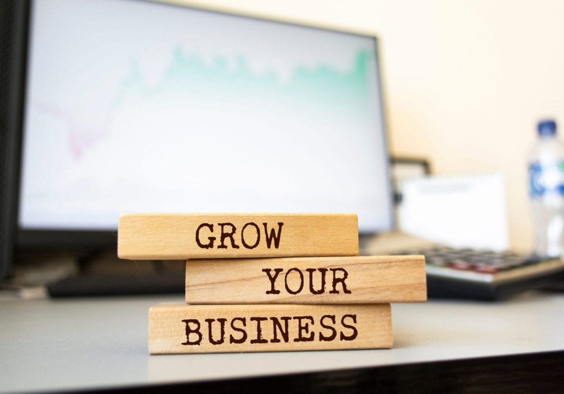 blocks on a desk spelling Grow Your Business