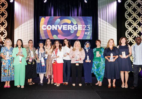 A group photo of the 2023 ICF Coaching Impact Award winners at ICF Converge 2023, proudly holding their awards in recognition of their contributions to the coaching profession.