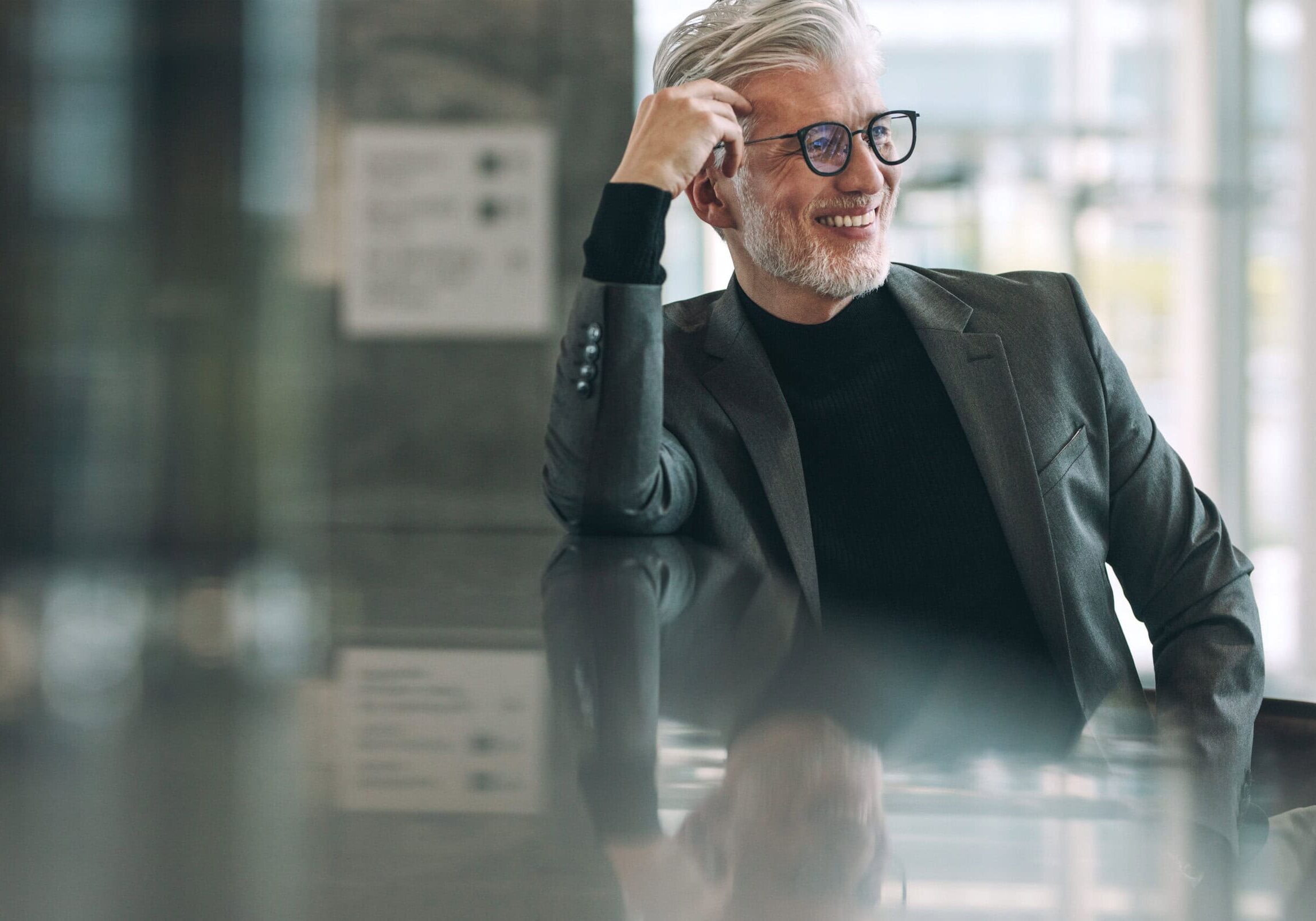 An older professional man advanced to his ICF Master Certified Coach (MCC) credential