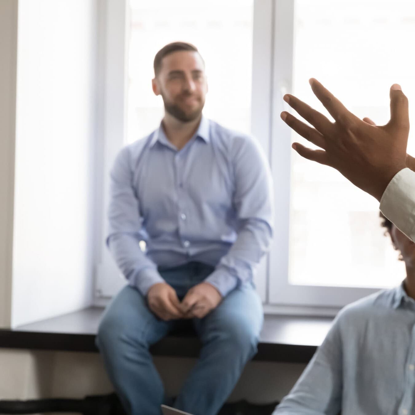 A man goes over the team coaching competencies with his team.