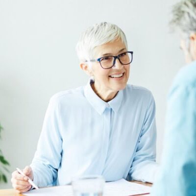 Coach researching educational programs for career-long development.