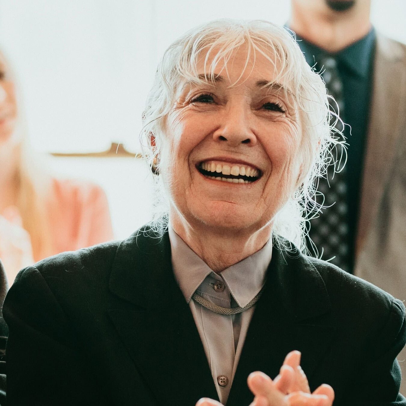 A woman is celebrating and cheering on during an event