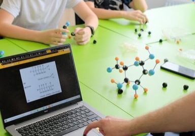 Vladyslava Bandurko school in Ukraine, showing kids how to model a molecule