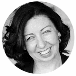 Jenn Wicks PCC headshot photo, black and white image of woman with dark hair smiling