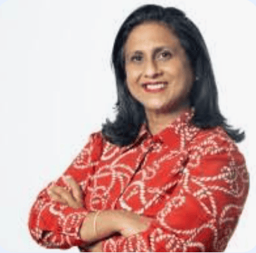 Philippe Rosinski MCC Lola Chetti MCC headshot photo, smiling woman with dark hair wearing red shirt and folding arms over torso in front of white background